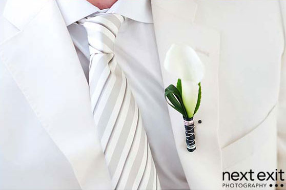 boutonniere and white tie groom