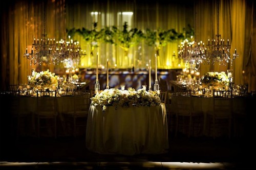 lush-yellow-and-green-estate-table-centerpieces-chandeliers