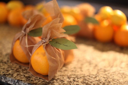 orange-wrapped-in-parchment-paper-tied-with-raffia-and-goccoed-leaf