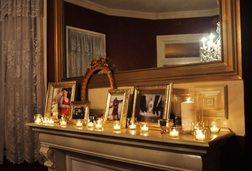mantle with framed photos