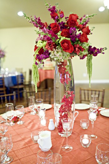 tall purple and red rose centerpiece
