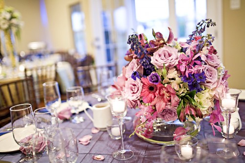 purple and pink centerpiece with purple linens