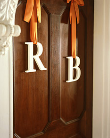 monogram-letters-on-church-door-hanging-from-ribbon