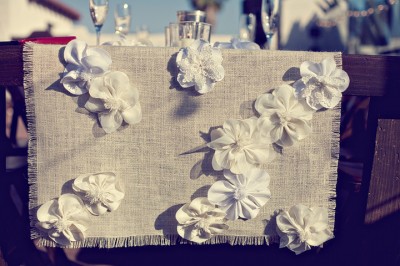 handmade table runner with white fabric flowers