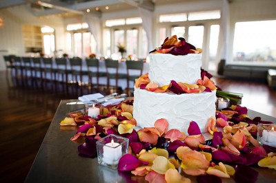 white-cake-raspberry-and-orange-flower-petals