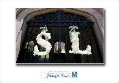 white-flower-monogram-letters-on-church-gates
