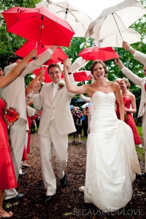 exiting-ceremony-under-red-and-white-umbrellas