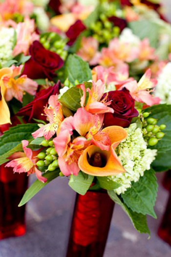 red-orange-yellow-bridesmaids-bouquets