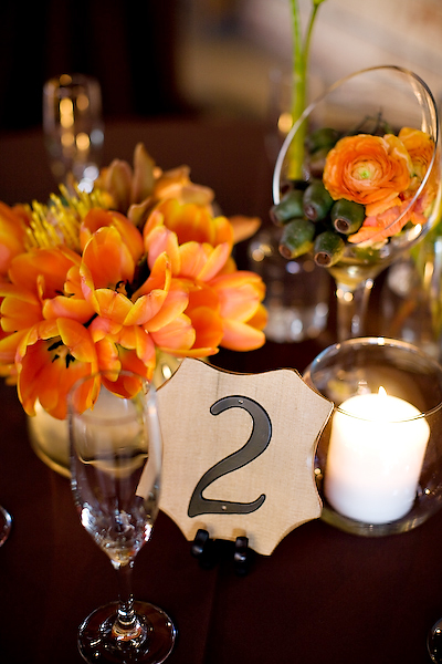 orange-centerpieces-wood-table-numbers