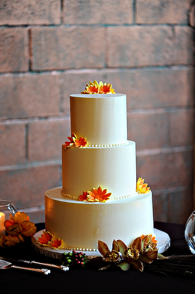 white-cake-with-orange-flowers