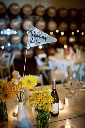 yellow-diy-wedding-centerpieces-fabric-flag-table-numbers