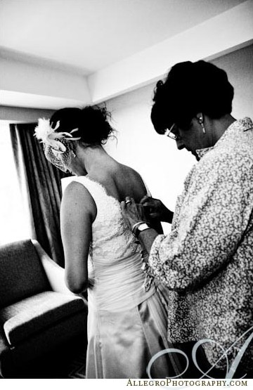 bride-putting-on-gown