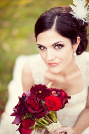 bride-with-hair-feather-red-bouquet