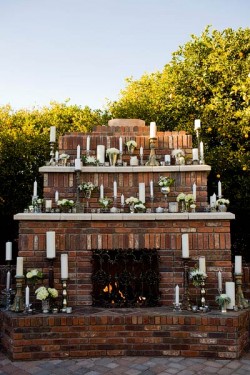 outdoor-fireplace-covered-in-candles