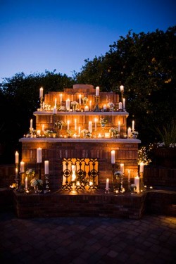 outdoor-fireplace-decorated-with-candles-wedding-decor