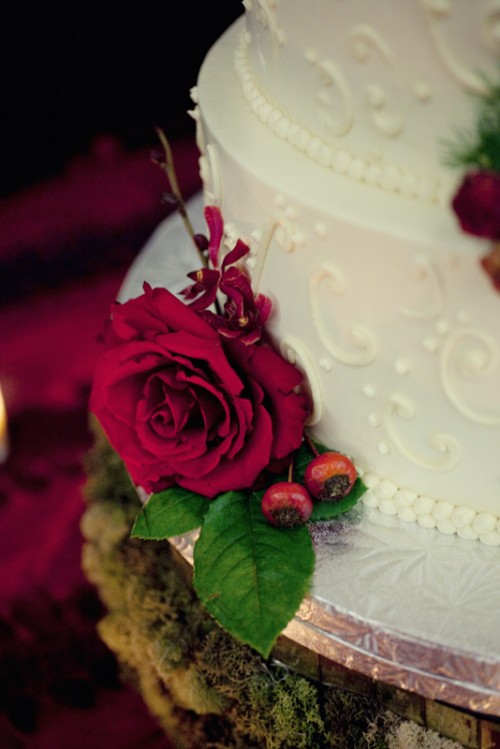 white-wedding-cake-with-red-flowers