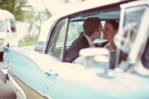 Bride and Groom in Classic Car