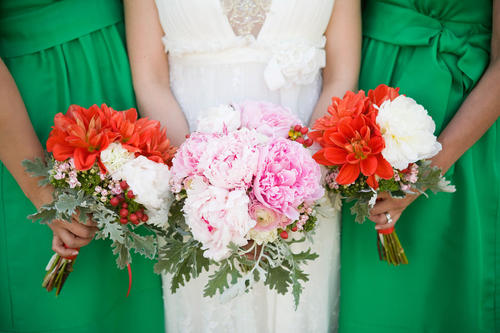 pink and red bouquets with green bridesmaids dresses
