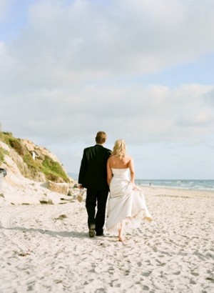 Bride and Groom Walking on the Beach