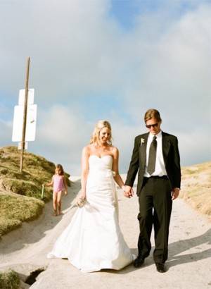 Bride and Groom Walking towards the Beach