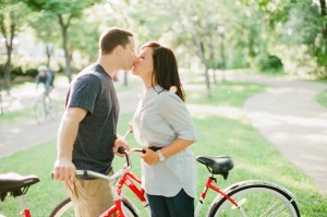 Couple Kissing on Red Bikes 1