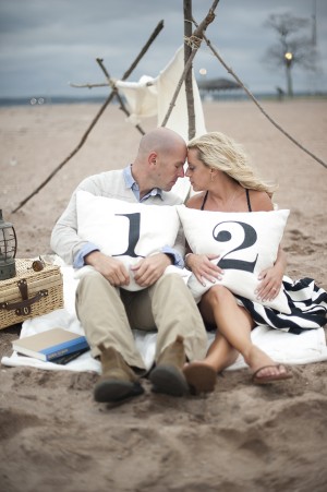 Engagement Photo with Numbered Pillows on the Beach