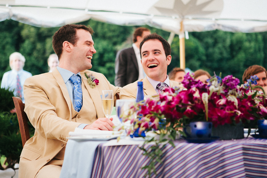 Grooms Laughing at Reception
