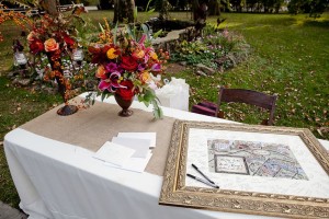Guest Table With Pink Red and Orange Fall Flowers