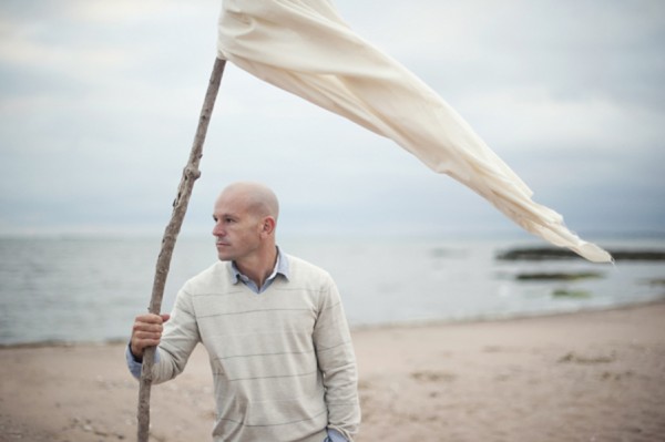 Male with Flag on the Beach