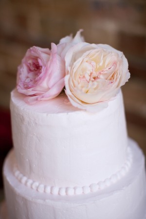 Pale Pink Wedding Cake With Flower Topper