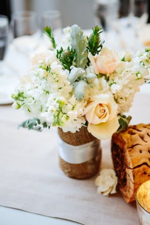 Pale Reception Table Flowers in Burlap Vase