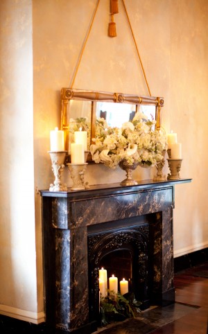 Reception Flowers and Candles Over Fireplace