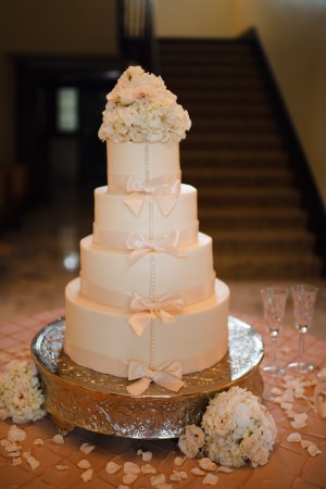 Four Tier Round Wedding Cake With Bow Details and Hydrangeas