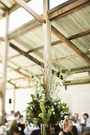 Green and White Reception Arrangement With Twigs