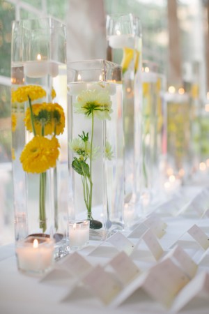 Place Card Table With Yellow Flowers and Tall Glass Vases