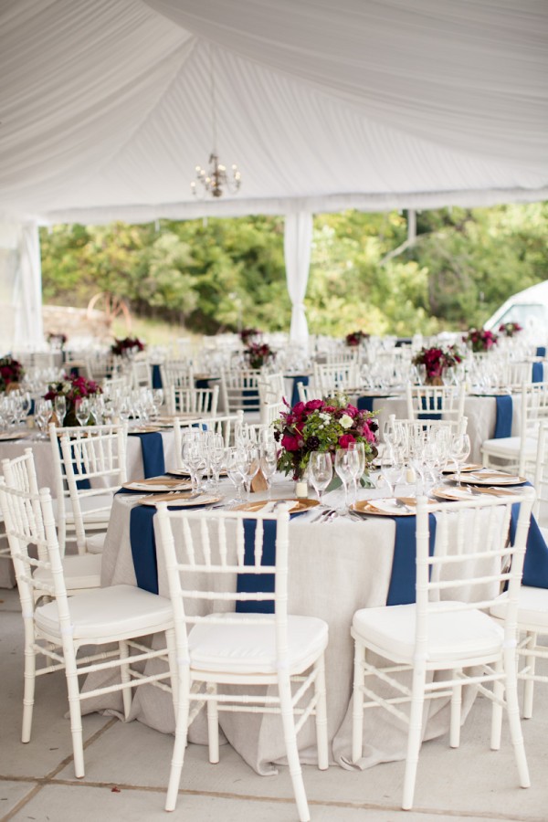 Round White Reception Tables With Blue Napkins
