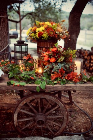 Rustic Wagon With Fall Arrangements Lantern and Candles