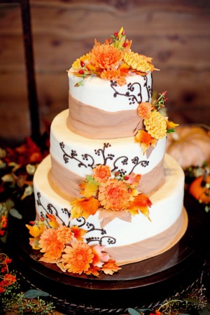 Three Tier Round Wedding Cake With Cascading Burlap and Flower Garland