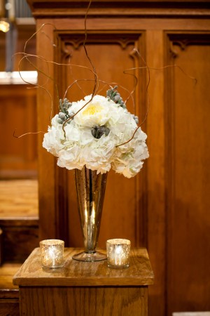 White Flowers With Gray Berries and Twigs in Mercury Glass Vase
