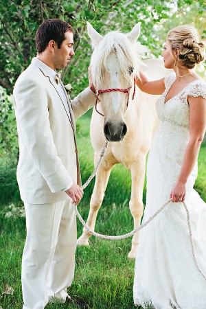 Bride and Groom in Meadow With White Horse1