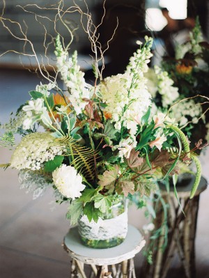 Green and White Arrangement in Glass Jar With Lace