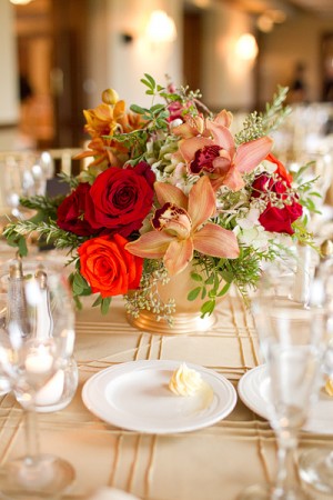 Orange Red and Pink Flowers in Gold Vase