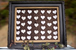 Paper Hearts With Marriage Wishes on Framed Corkboard