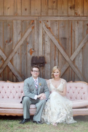 Bride and Groom Sitting on Vintage Pink Sofa