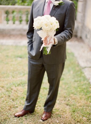 Groom Holding White Rose Bridal Bouquet