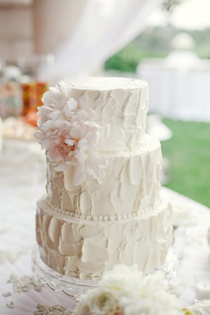 Three Tier Textured Wedding Cake With Pink Flowers