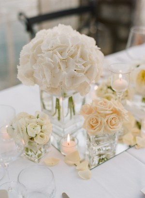 White and Pale Peach Flower Arrangements in Clear Glass Vases
