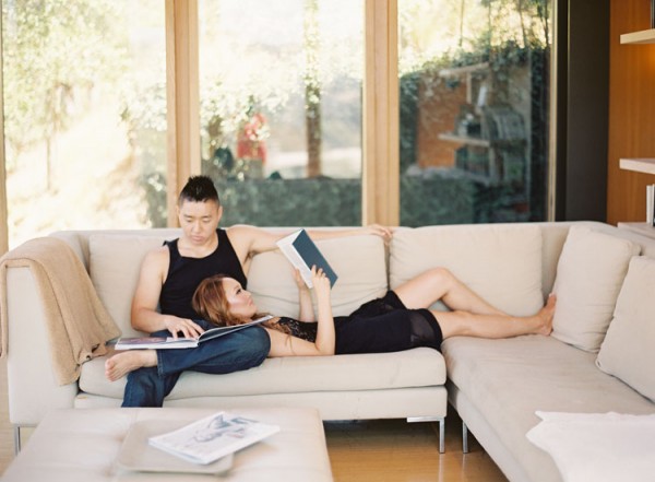 Couple Reading Books on Modern Couch