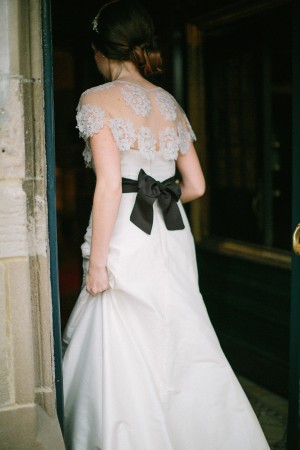 Elegant Lace Gown with Black Sash
