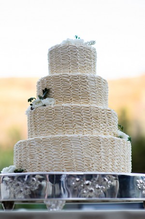 Four Tier Wedding Cake With Folded Icing